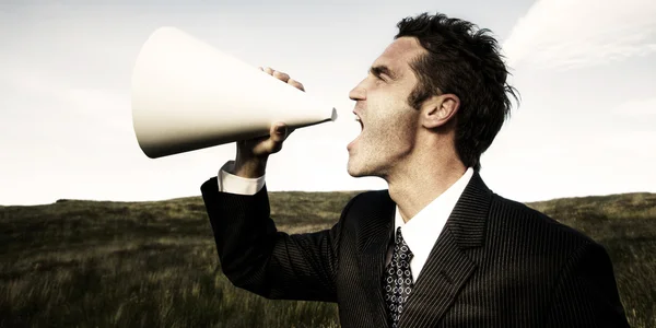 Businessman in suit with Megaphone — Stock Photo, Image