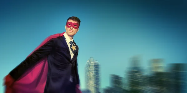 Superhero Businessman in modern city — Stock Photo, Image