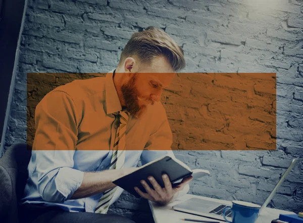 Businessman writing in notebook — Stock Photo, Image