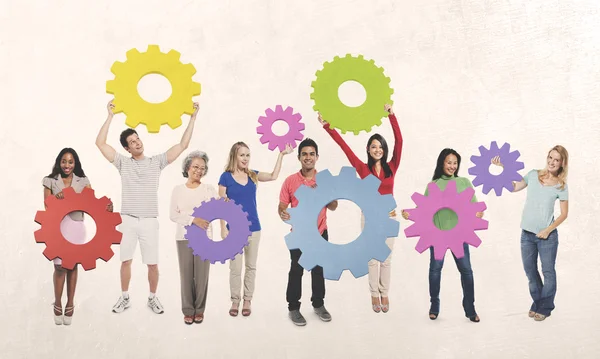 Diversity People holding Gears — Stock Photo, Image