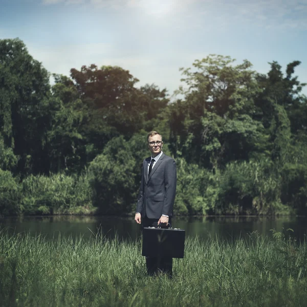 Businessman costs with case — Stock Photo, Image