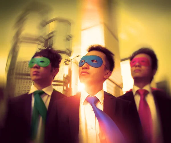 Businessmen in colorful superhero masks — Stock Photo, Image