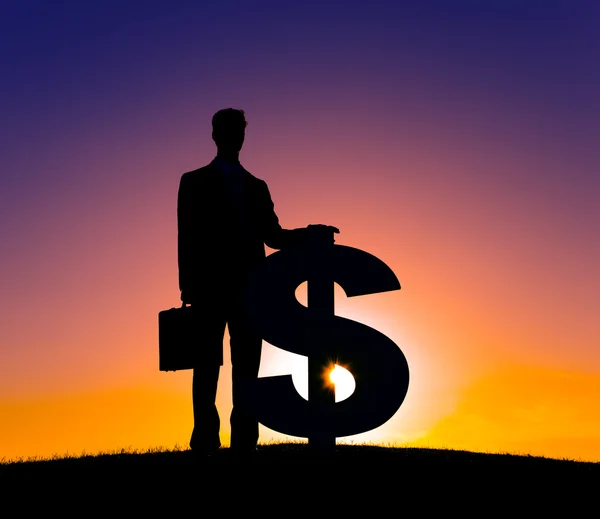 Businessman and money symbol — Stockfoto