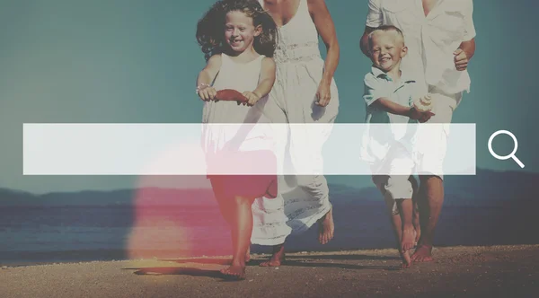 Family having fun on the beach — Stock Photo, Image