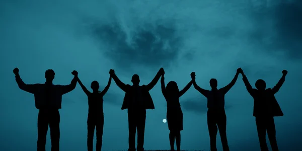 Business people rising hands up together — Stock Photo, Image