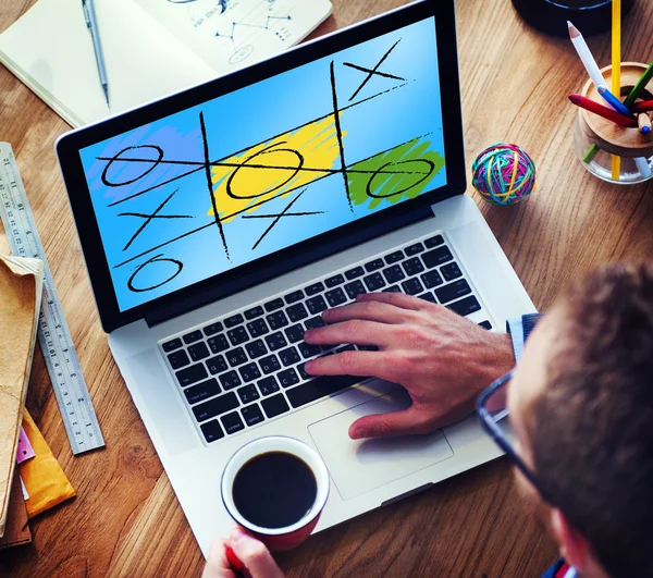 Man Using Laptop with Leisure Game — Stock Photo, Image