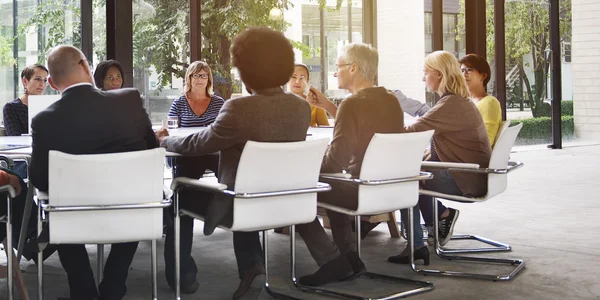 Business people at meeting table — Stock Photo, Image