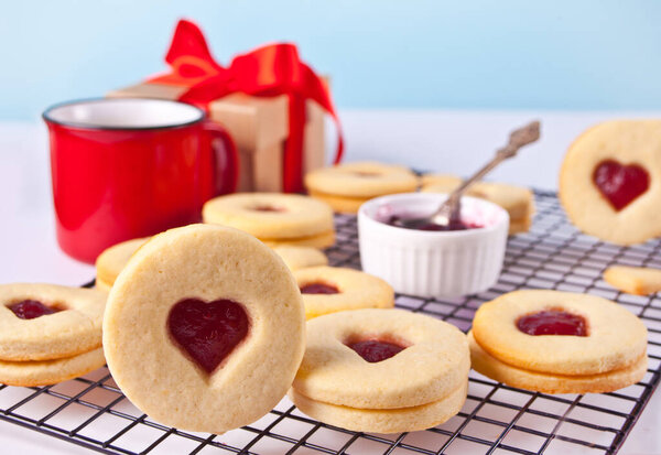 Heart shaped traditional linzer cookies with strawberry jam. Valentine s day concept