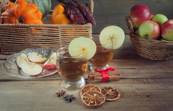 Autumn drinks with spices on the wooden table