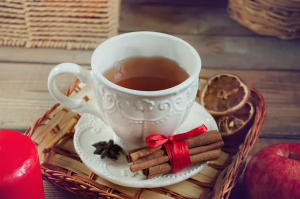 Cup of tea with spices on the wooden table — Stock Photo, Image