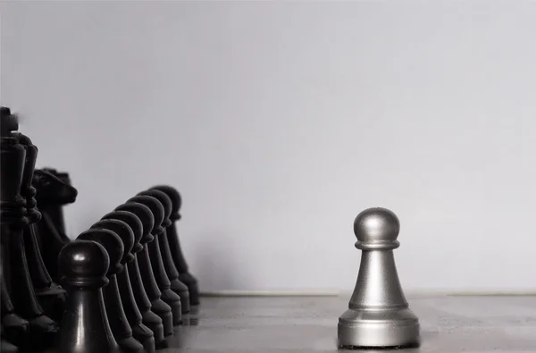 Light and dark wooden chess pieces on chess table. — Stock Photo, Image