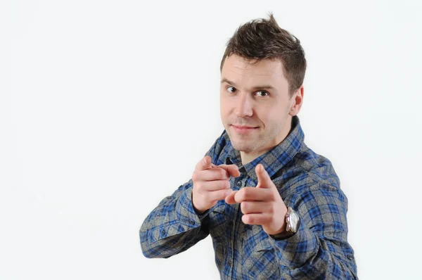 Portrait handsome young smiling man giving thumbs up pointing fingers at camera — Stock Photo, Image