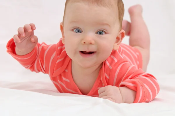 Adorable cute little girl with big blue eyes and wide smile play — Stock Photo, Image