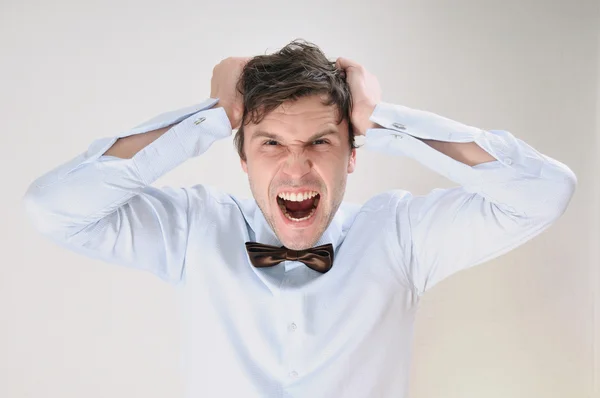 Emotional portrait of attractive screaming man on white backgrou — Stock Photo, Image