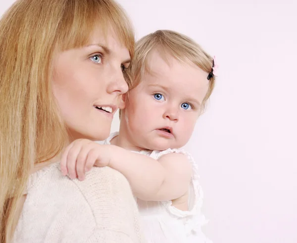 Family portrait of caring mother and her cute little baby girl — Stock Photo, Image