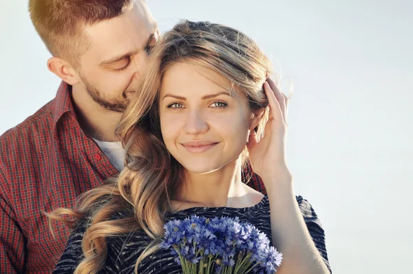 Stunning sensual young couple in love in summer field — Stock Photo, Image