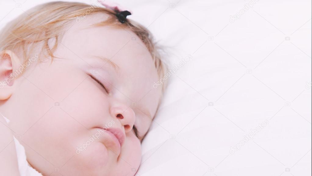 close up portrait of little sleeping baby girl