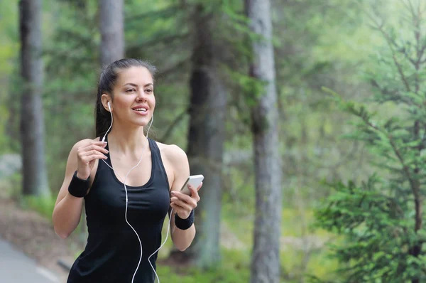 Healthy lifestyle fitness sporty woman with headphone running in Stock Image