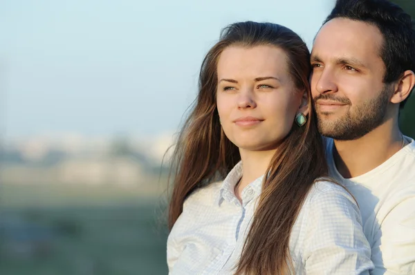 Portrait of young sensual couple on sunset — Stock Photo, Image