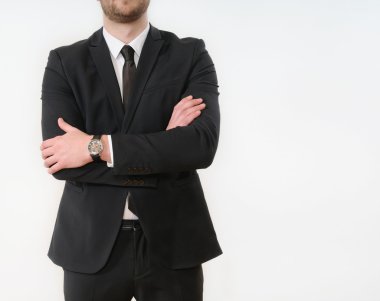 business man body side folded his arms in black suit on white ba