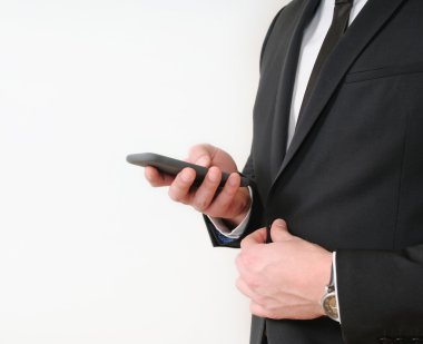 Elegant young businessman using his  tablet 
