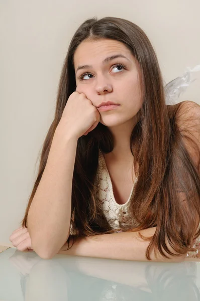 Portrait of sad angel girl looking up and thinking with sorrow — Stock Photo, Image