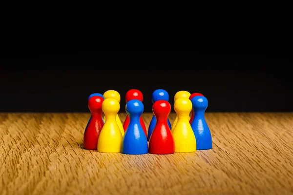 Concepto trabajo en equipo rojo amarillo azul — Foto de Stock