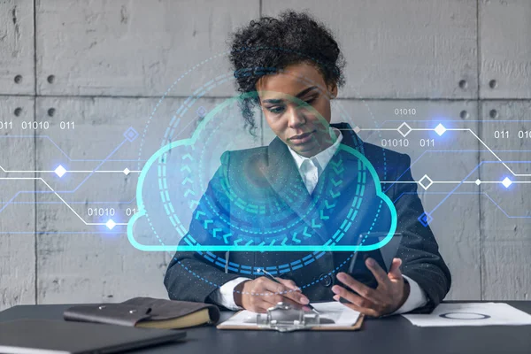 Businesswoman taking notes and cloud storage hologram. Double exposure. Business technology solution.