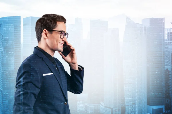 stock image Prosperous handsome entrepreneur in suit and glasses pensively talking phone and looking on Singapore cityscape. The concept of problem solving consulting . Downtown view. Double exposure.