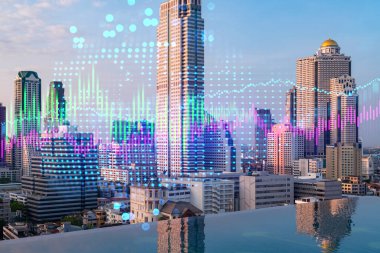 Pazar davranışı hologramı, günbatımı panoramik şehir görüntüsü, Asya 'da finansal derece alabilmek için popüler bir yer. Finansal veri analizi kavramı. Çift pozlama.