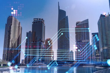 Şehir merkezindeki Dubai gökdelenleri. Uluslararası ticaret ve finansal hizmetler merkezi. Teknoloji teması hologramları, Fintech konsepti. Çifte maruziyet. Dubai Kanalı Rıhtımı.