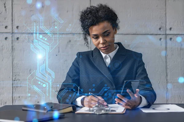 Businesswoman taking notes and tech drawing hologram. Double exposure. Business technology solution.
