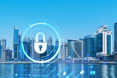 Şehir merkezindeki Dubai gökdelenleri. Uluslararası ticaret ve finansal hizmetler merkezi. Simge hologramını kilitle, veri güvenliği kavramı. Çifte maruziyet. Dubai Kanalı Rıhtımı.