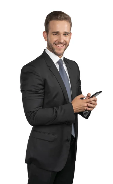 Empresario en traje y corbata con teléfono aislado sobre fondo blanco —  Fotos de Stock