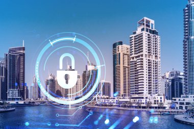 Şehir merkezindeki Dubai gökdelenleri. Uluslararası ticaret ve finansal hizmetler merkezi. Simge hologramını kilitle, veri güvenliği kavramı. Çifte maruziyet. Dubai Kanalı Rıhtımı.