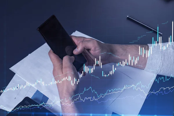 Trader holding in the hands a smart phone and researching stock market to proceed right investment solutions. Internet trading and wealth management concept. Hologram Forex chart over close up shot. — Stock Photo, Image