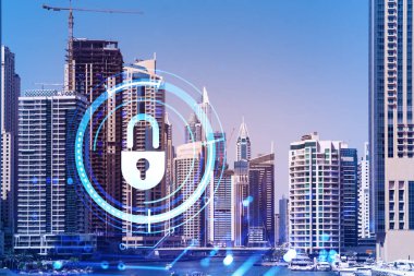 Şehir merkezindeki Dubai gökdelenleri. Uluslararası ticaret ve finansal hizmetler merkezi. Simge hologramını kilitle, veri güvenliği kavramı. Çifte maruziyet. Dubai Kanalı Rıhtımı.