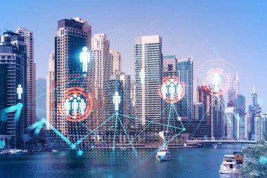 Şehir merkezindeki Dubai gökdelenleri. Uluslararası ticaret ve finansal hizmetler merkezi. Sosyal ağ ikonları hologram, insan kaynakları kavramı. Çifte maruziyet. Dubai Kanalı Rıhtımı.