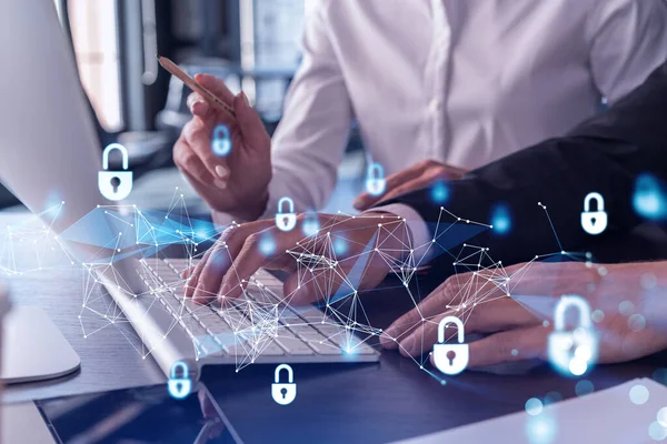 Two businesspeople in formal wear working on the project to protect cyber security of international company using laptop. Padlock Hologram icons. Teamwork concept. — Stock Photo, Image