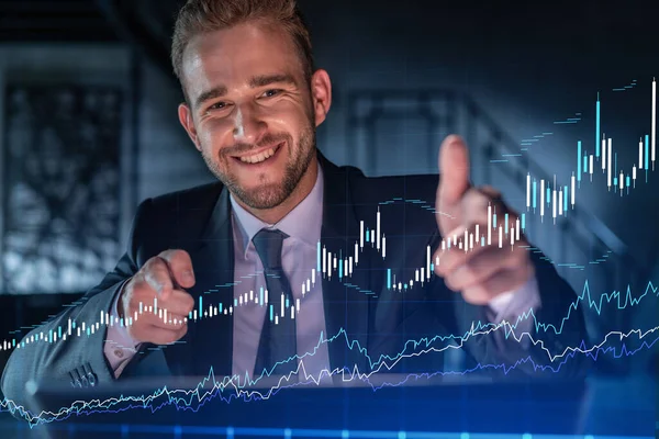 Portrait of handsome businessman in formal suit thinking how to optimize trading strategy at corporate finance fund. Forex chart hologram over modern office background