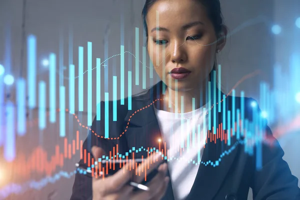 Businesswoman typing phone, work in modern office on new project. forex graph hologram. Double exposure. Concept of success in online trading. Mobile app.