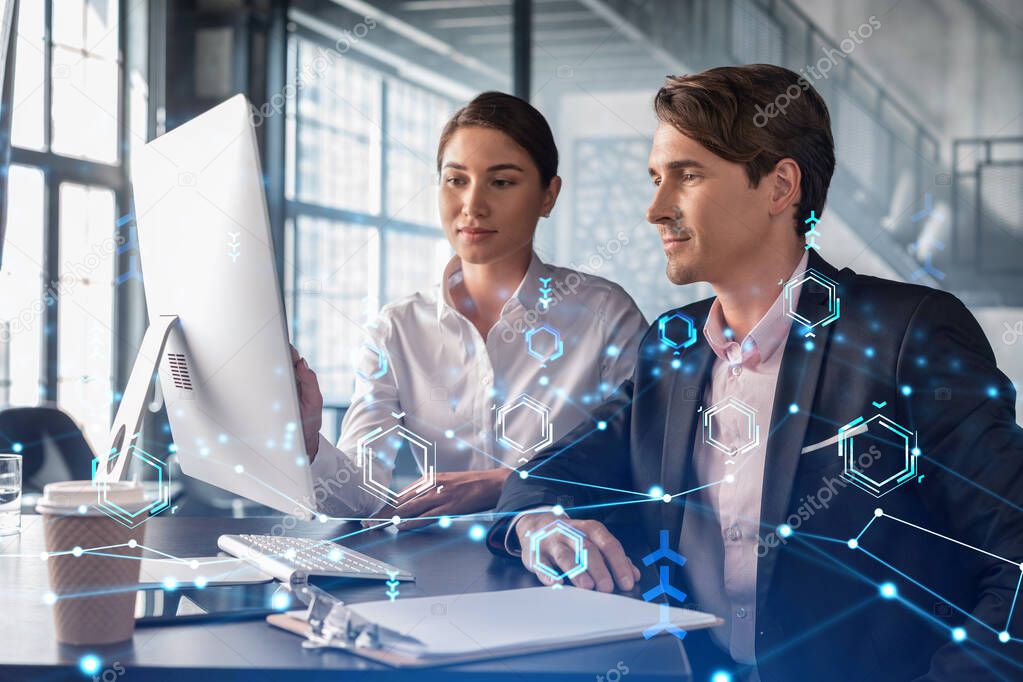 Businessman and businesswoman in formal wear working together to optimize business process by applying new technologies. Hi tech holograms over modern office background with panoramic windows