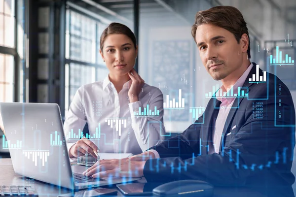 Businessman and businesswoman in formal wear working together to optimize trading strategy at corporate finance fund. Forex chart hologram over office background with panoramic windows — Stock Photo, Image