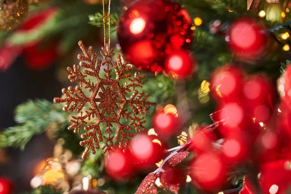 golden snowflake on christmas tree                                              