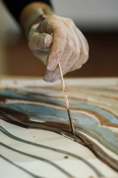 Gloved Hand Leads Thin Stick Creating Waves Overflows Epoxy Painting Fotos De Stock