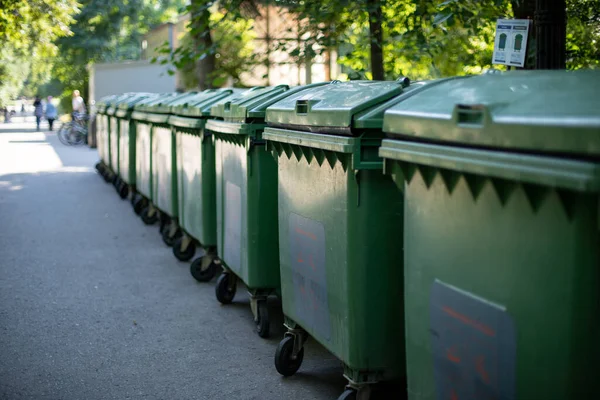 Separate waste collection bins in the park. Waste for processing, recyclable materials