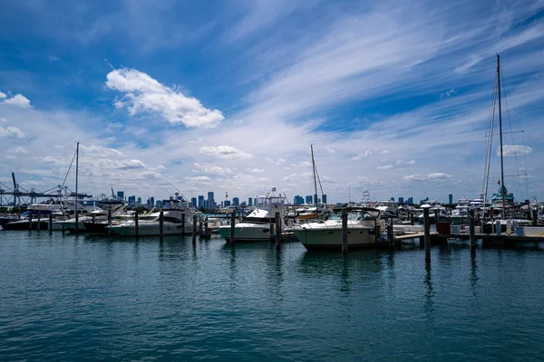 Yachts in Miami. Expensive vacation on the ocean. Ocean, sky and the city.