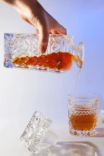 Alcoholic drink in a beautiful old glass and decanter