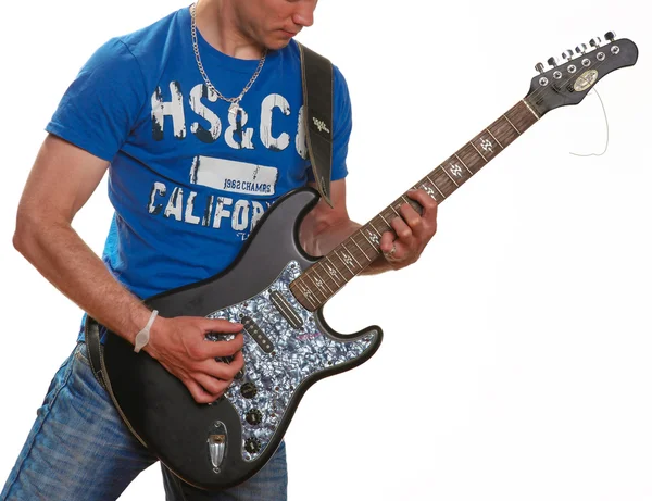 Guitar, electric guitar, a man holding a guitar in his hands — Stock Photo, Image