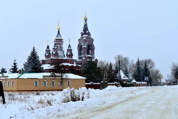 village church by the road in winter